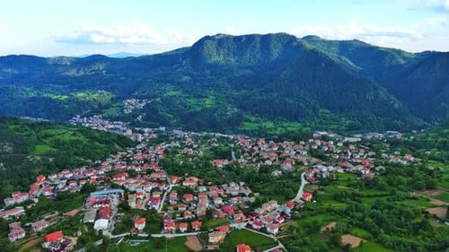 View From Rock to Town of Smolyan with Meadows for Cattle Walking and Houses Between Mountain Range