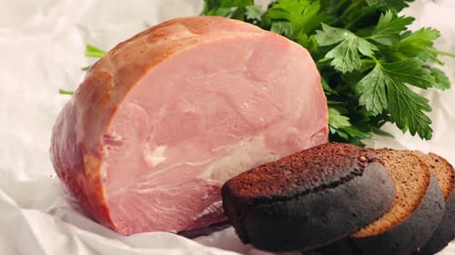Closeup Farm Ham with Rye Bread and Parsley on Wooden Cutting Board Snack and Breakfast Concept