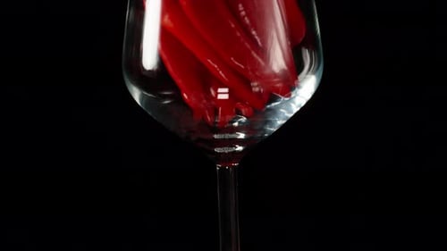 Red Chili Peppers Filling a Wine Glass