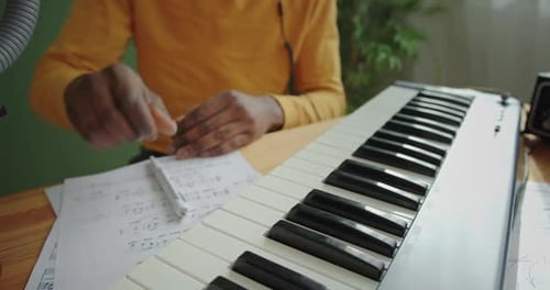 Musician Composes Music and Plays Keyboard