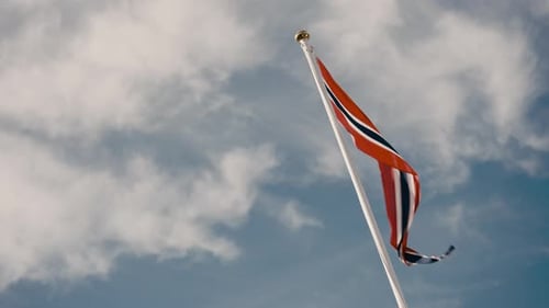 National Flag Waving Gently against Cloudy Sky
