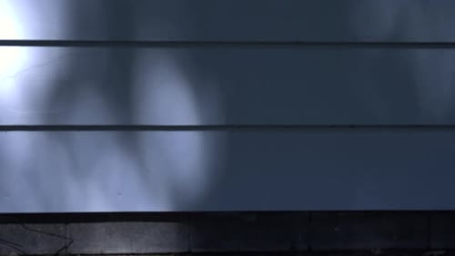 Abstract Blue Wall with Mottled Shadows