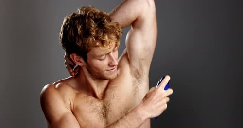 Beauty, spray and man in studio, cosmetics and grooming on gray background