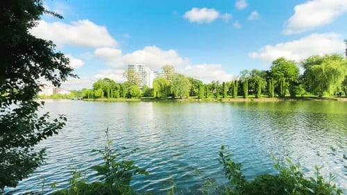 Panoramic view of the lake and blue sky with clouds.