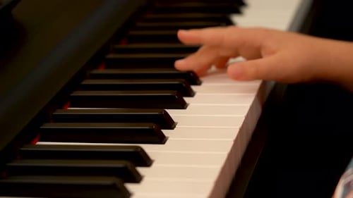 Child Plays Piano, Close Up