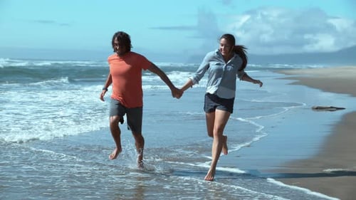 Couple At Beach Running In Super Slow Motion