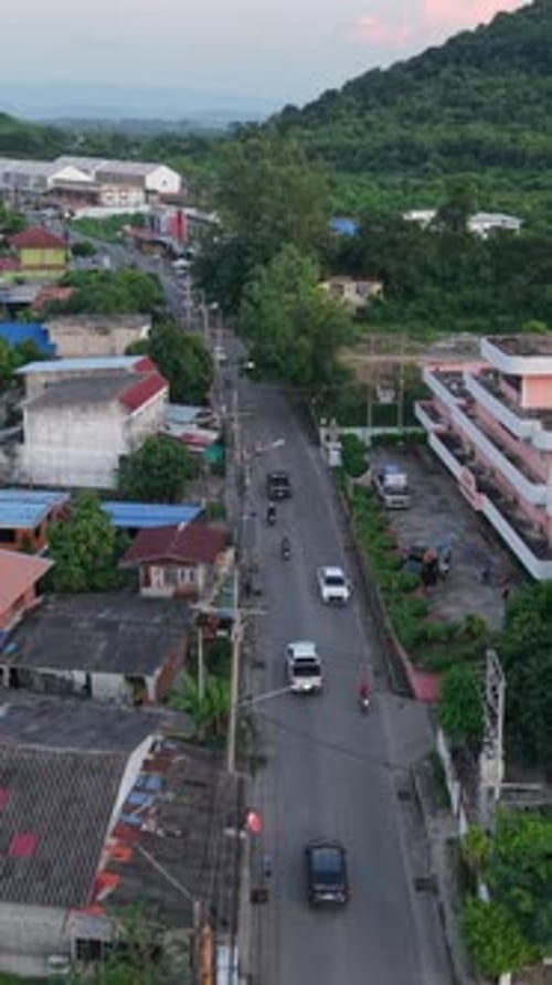 Drone Following the Road From the Air in a Rural Area of Thailand Between the Mountains