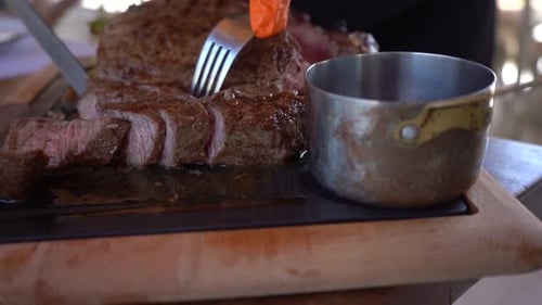 Close Up of Chef Slicing a Steak