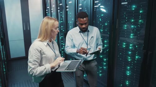 IT Engineers Working in Modern Data Center