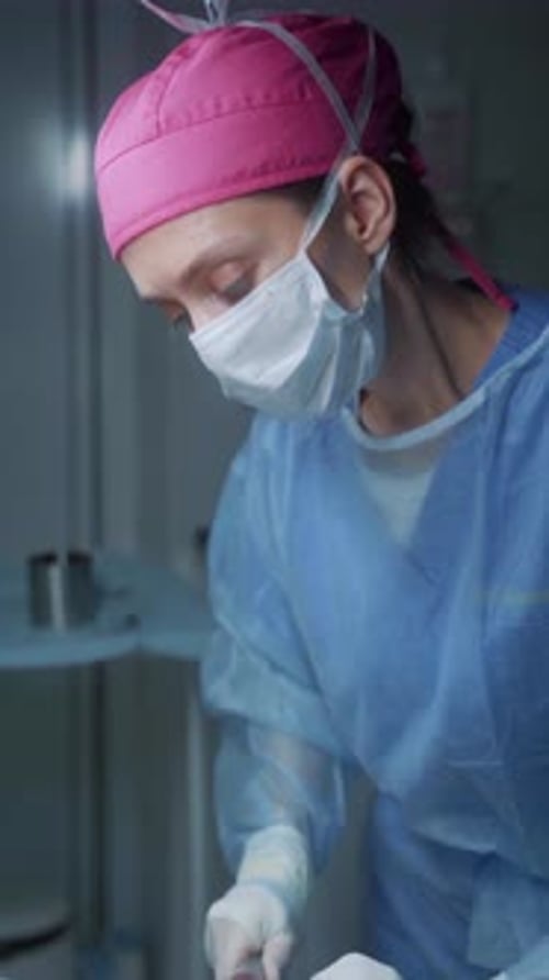 Surgeon Performing Operation in Hospital Setting