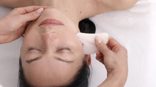 Woman Receives Relaxing Facial Massage Treatment