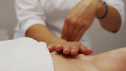 Massage Therapist Gives Hand Massage To Patient