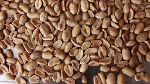 close up of peeled roasted peanuts, healthy nuts, protein food. Isolated background of roasted peanu
