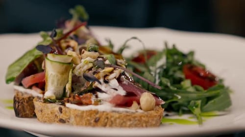 Close-up of bruschetta with jamon and cream cheese cooked in the professional kitchen
