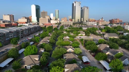 Residential neighborhood in Fort Worth Texas. Urban city skyline in distance. Golden hour shot.