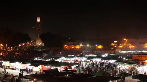 Timelapse of mosque and souks at night in Marrakech Morocco from above and aerial view