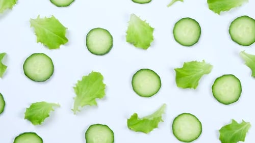 Fresh Cucumber and Lettuce on White Background
