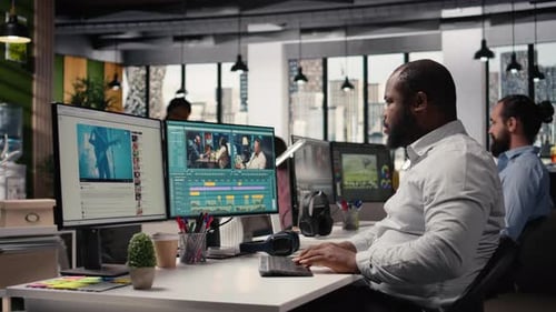 African American Filmmaker Editing Video Footage for Content Production
