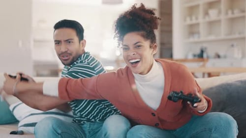 Couple, gaming and sofa with controller, laugh and funny conflict with cheating