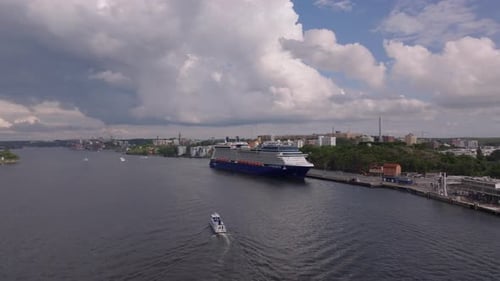 Cruise Ship Docked in Coastal City Aerial View