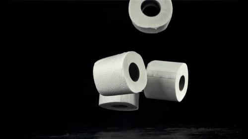 Toilet Paper Falls on the Table On a Black Background Filmed on a Highspeed Camera at 1000 Fps