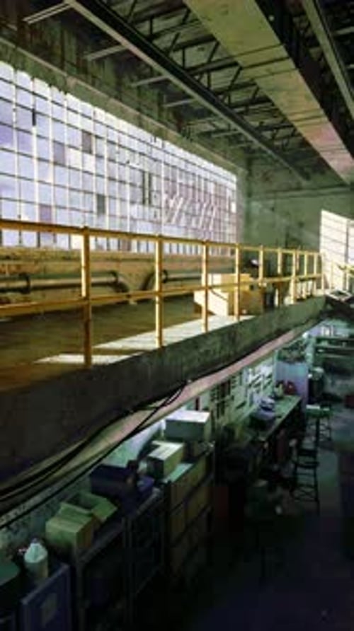 Dynamic Light Movement Across an Industrial Interior