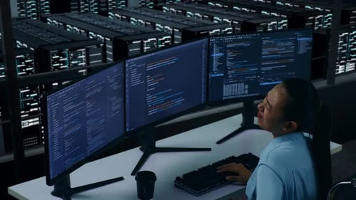 Side View Of Asian Woman Developer Having Backache While Write Code In Data Center