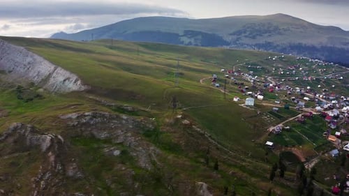 Ascending Drone Flight Above Highland Village At Sunset, Rural Scenery Of Summer Green Valley And Mo