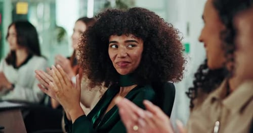 Employees Clapping at an Office Conference