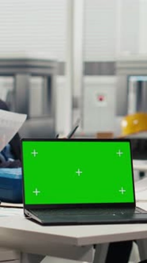 Vertical Video Researcher Analyzes Prototypes Using Laptop to Optimize Energy Production
