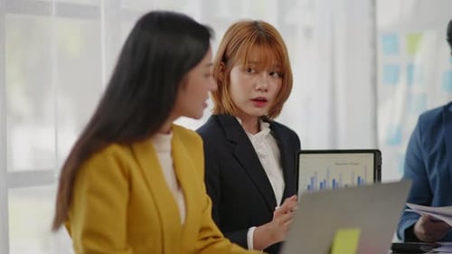 Business Team Discussing Graph Presentation