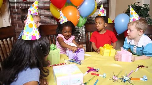 Children Opening Gifts at Birthday Party Celebration