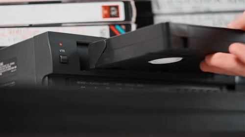 Insert VHS Cassette Into VCR Player