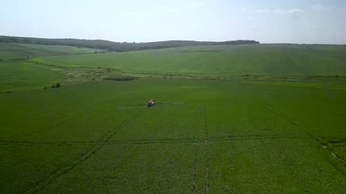 Spray Fertilize On Field With Chemicals In Agriculture Field