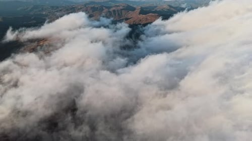 Clouds Over Mountainous Landscape Aerial View