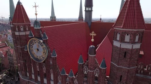 Drone Flight Around the Ancient Cathedral in the Center of the Old European Town with Tile Roofs