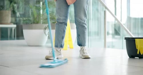 Cleaning, janitor and mop on floor of office for cleaner service, professional maid and maintenance