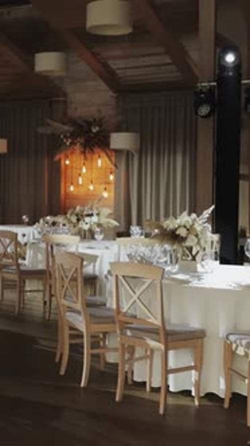 Beautifully Arranged Dining Space for a Romantic Wedding Reception Decorated Banquet Hall Chair