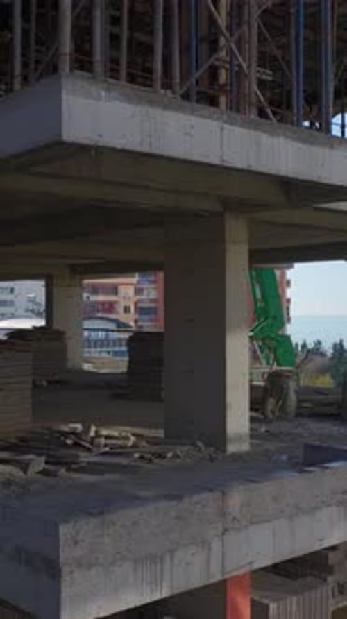 Vertical Video of Residential Construction in Progress With Concrete Metal and Wall Building