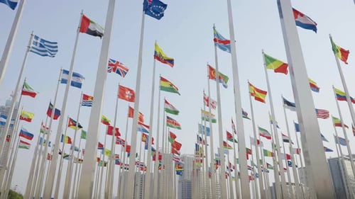 Global Flags Waving Tall in an Urban Setting