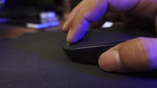 Click black computer mouse on a work desk