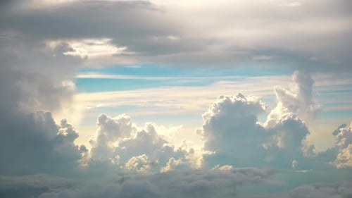 Puffy White Clouds Against Blue Sky, Aerial View