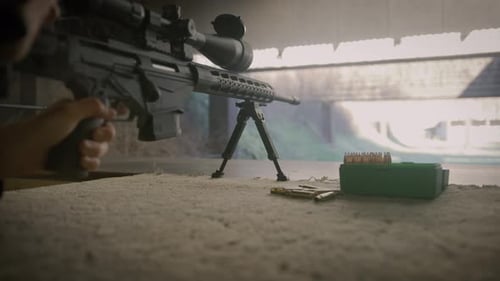 Taking shot with sniper rifle on shooting range. Weapon close up
