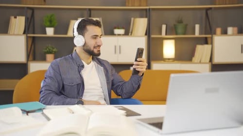 Young Adult on Video Call at Desk