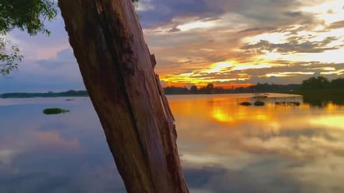 Beautiful sunset over the calm lake water