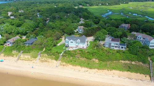Aerial Orbit of Cape Cod House by the Coast