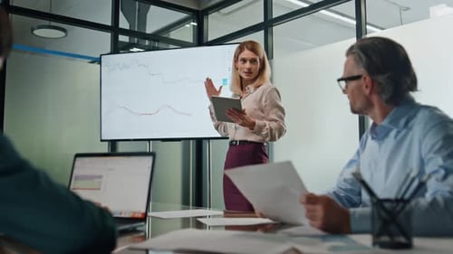 Business Woman Making Presentation at Modern Tv Office. Blonde Confident Specialist Pointing