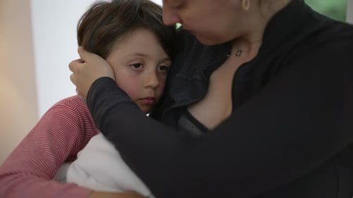 Mother Holding Newborn Baby with Child Embracing