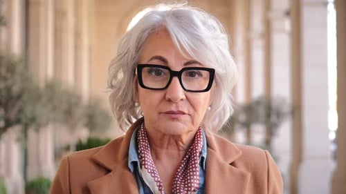 Senior Woman Wearing Stylish Glasses Standing Outside