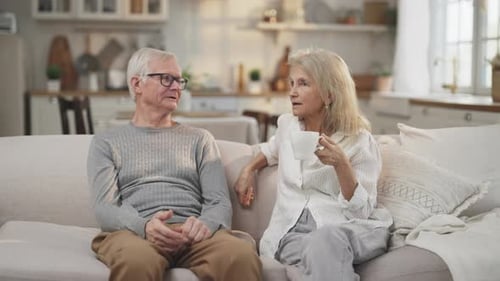 Senior Couple Enjoying a Quiet Conversation at Home